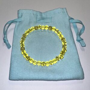 Yellow Stretch Translucent 6 mm Bead Bracelet with Soft Blue Drawstring Pouch